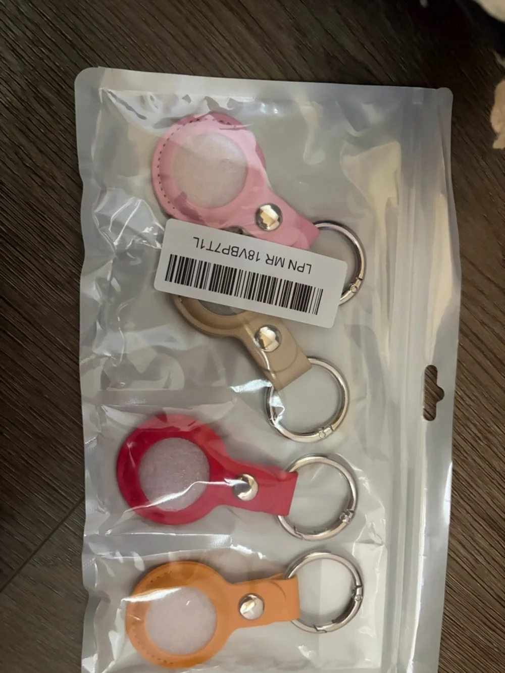 Set of 4 Silicone Airtag Keychain Holders - Pink, Beige, Red, Orange